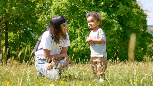 A lady and a little boy exploring the gardens at Cliveden, Buckinghamshire.